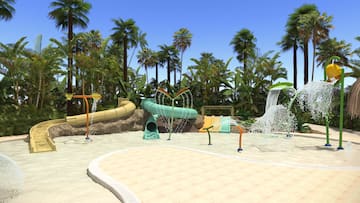 a water park with trees and water slides with Bávaro in the background