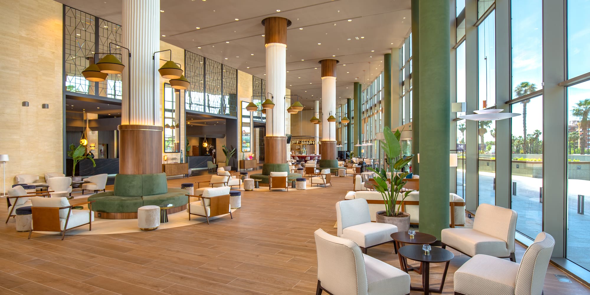 a large room with white chairs and tables