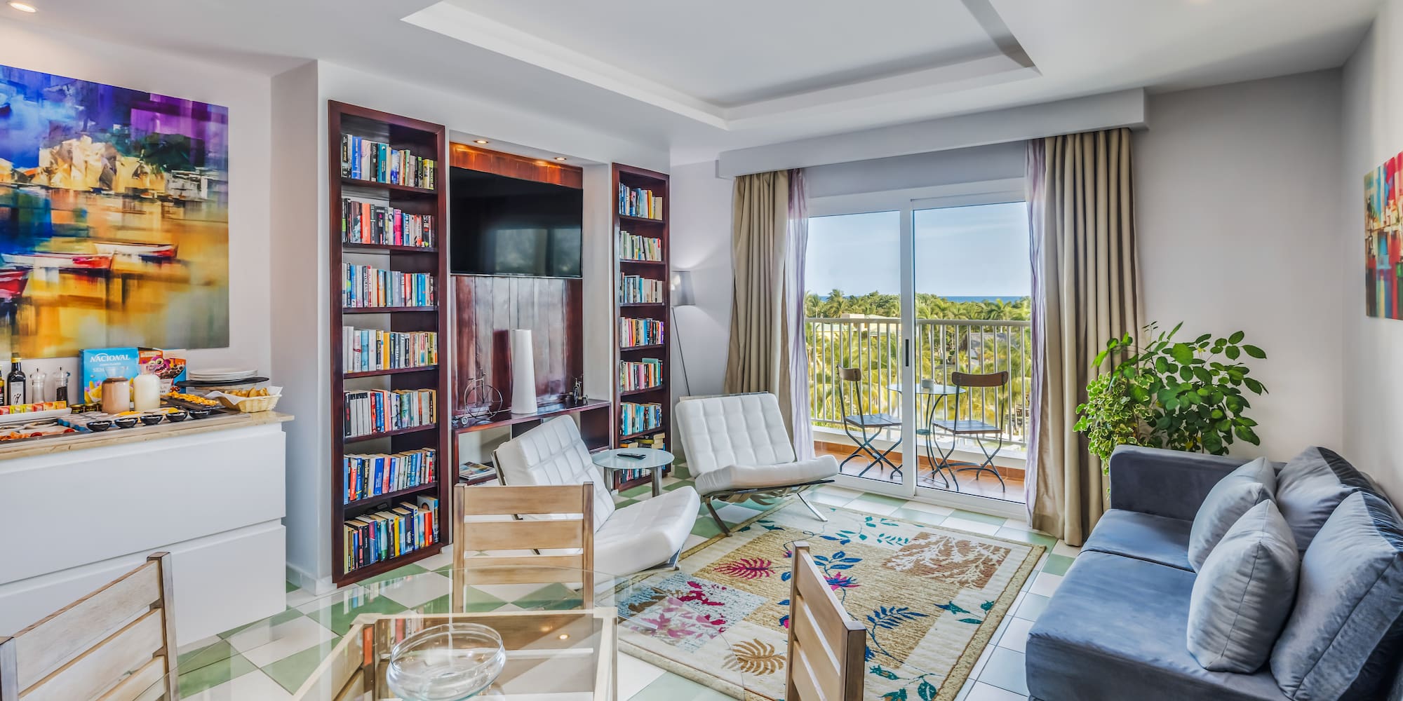 a living room with a couch and bookshelf