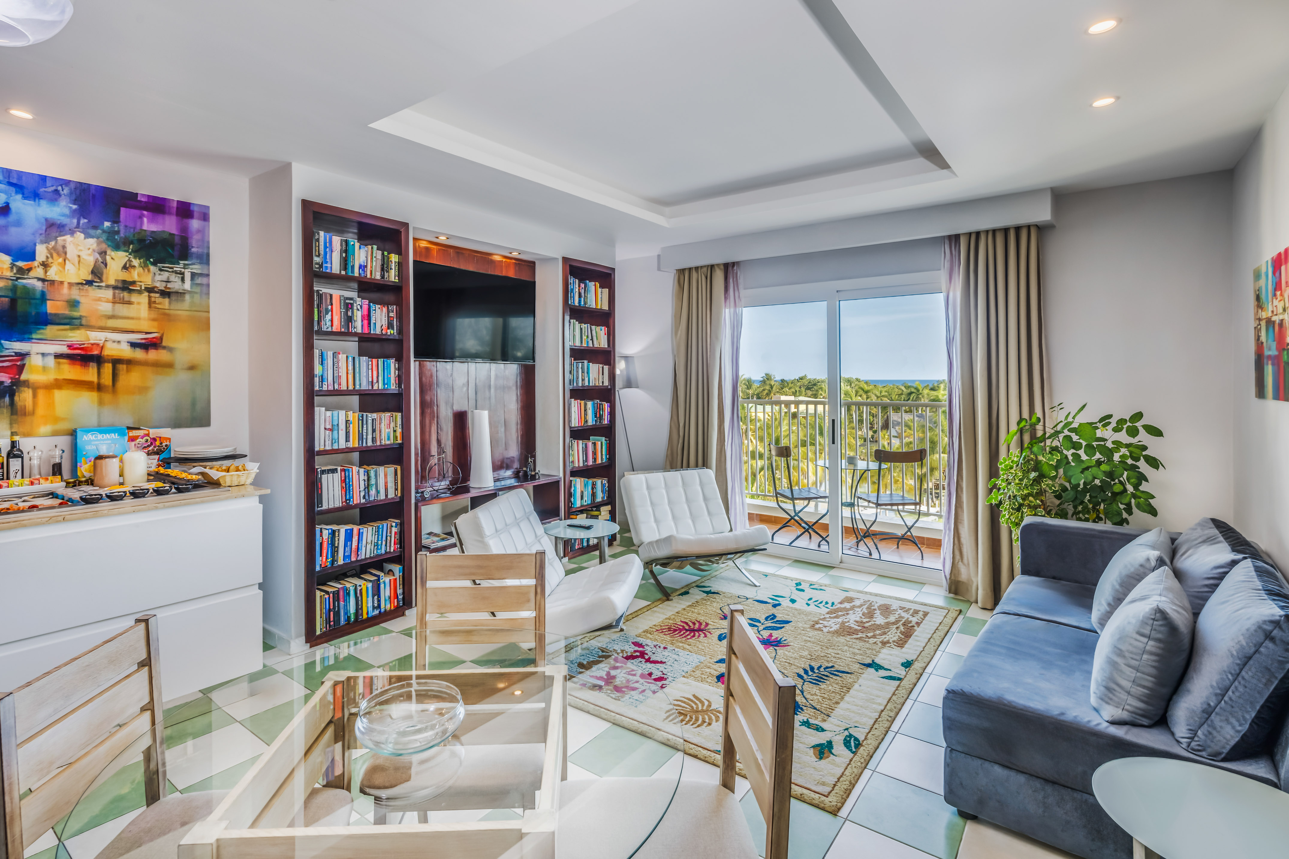 a living room with a couch and bookshelf