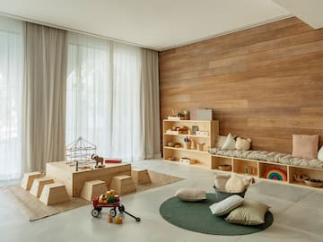 a room with a large wooden wall and a large window