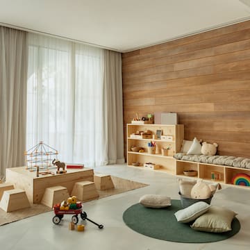 a room with a large wooden wall and a large window