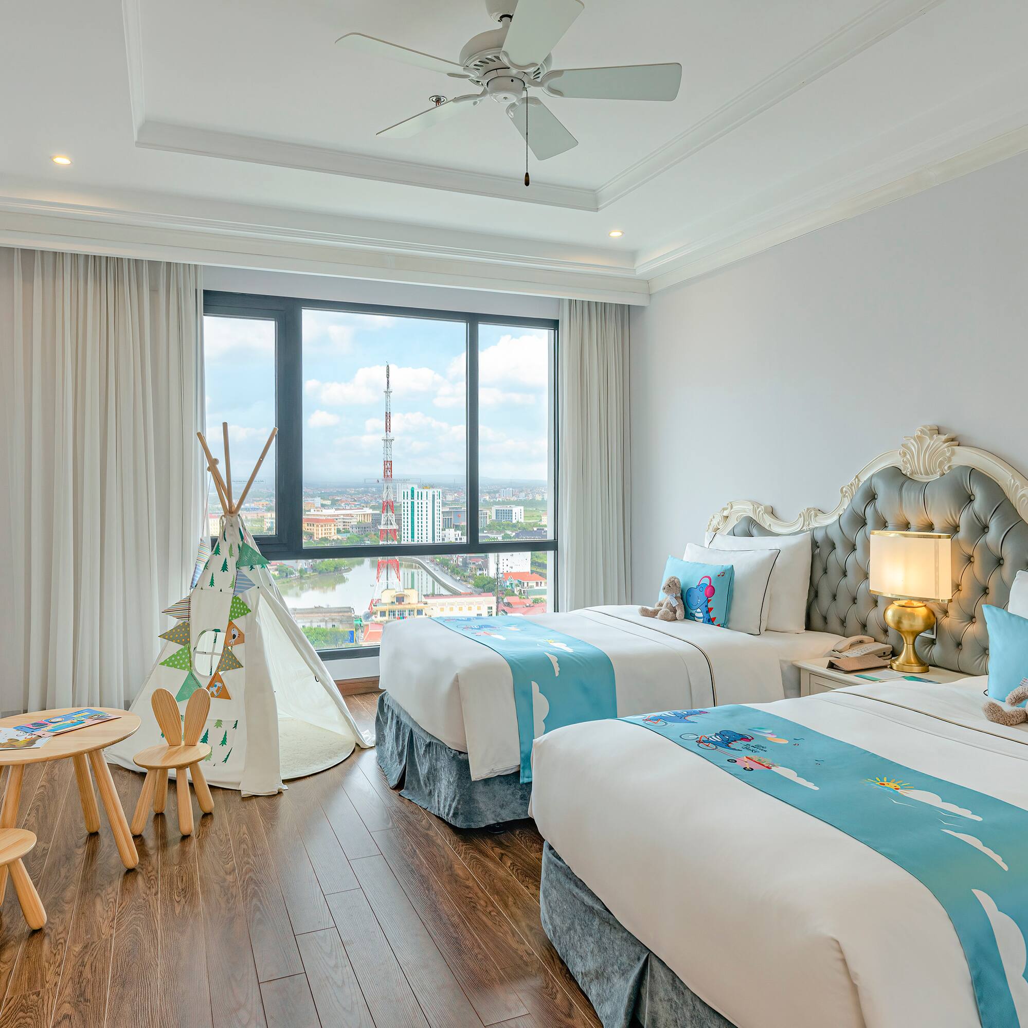 a bedroom with two beds and a tent