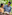 Smiling mother and daughter embracing outdoors, green foliage background.
