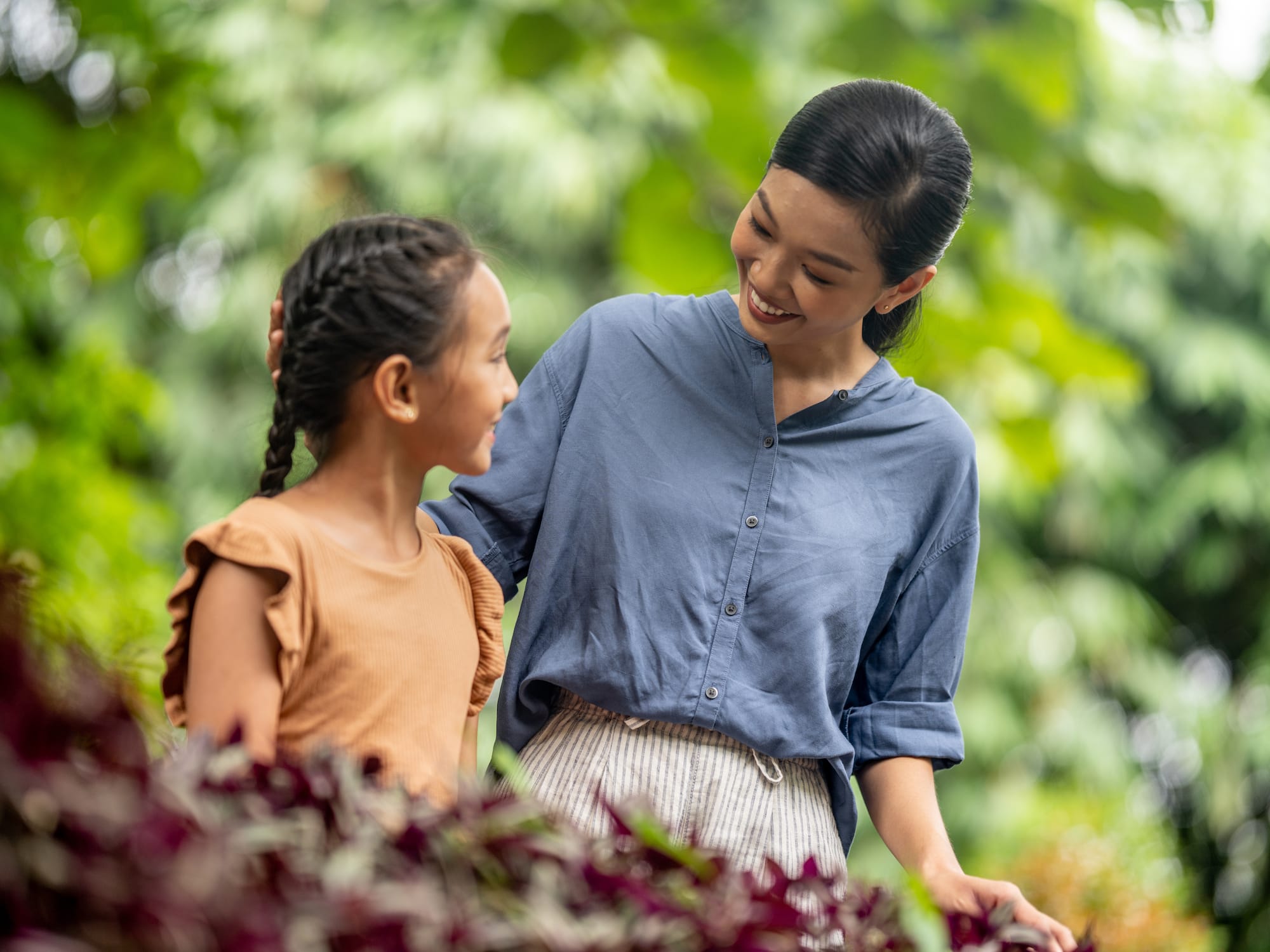 a woman and a girl smiling