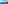 Helicopter aerial view of blue sea, green coastal mountains, and boats.