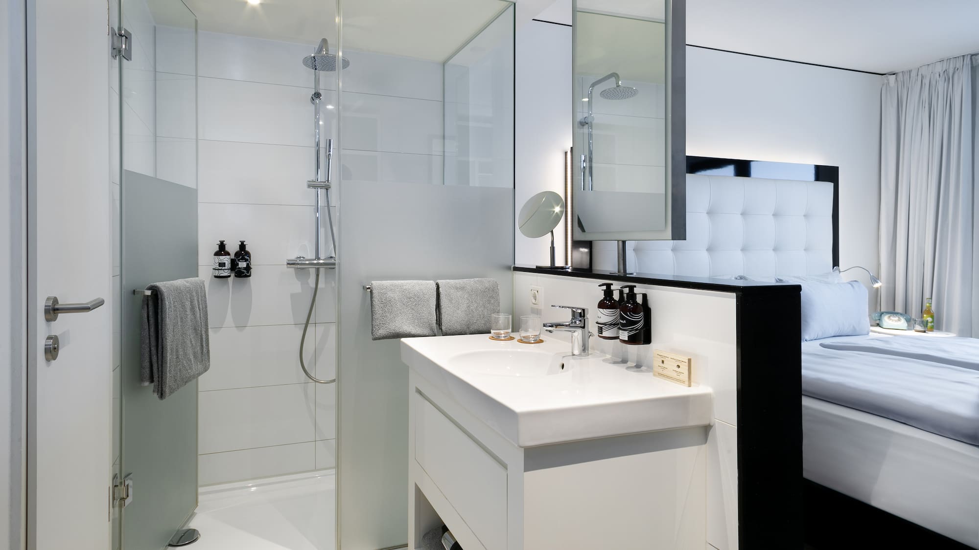 a bathroom with a shower and sink