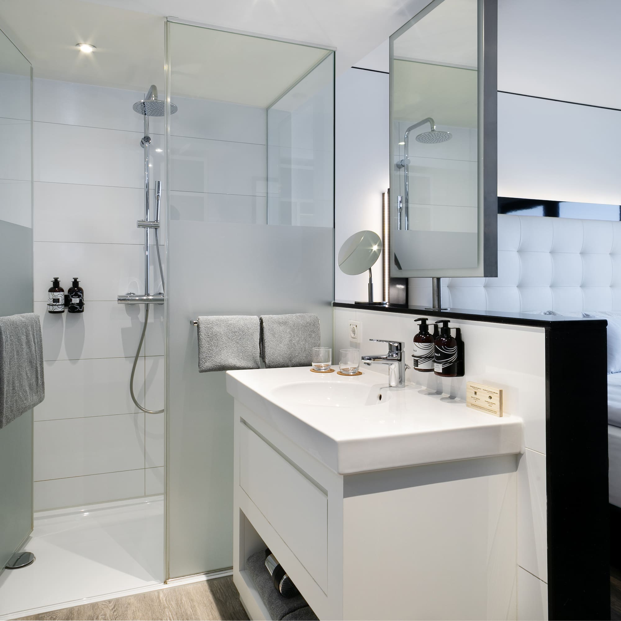 a bathroom with a shower and sink