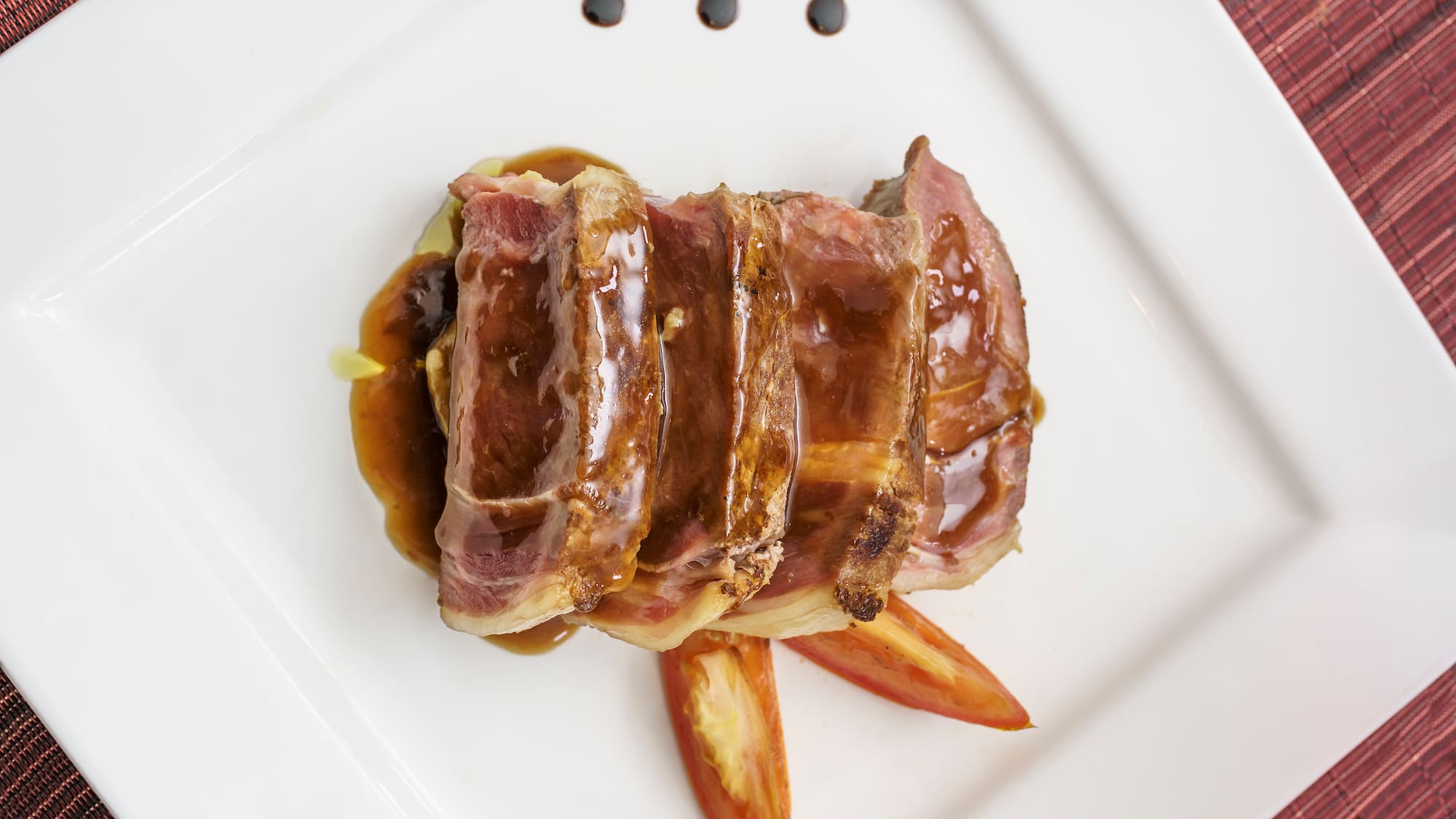 a plate of meat and sauce