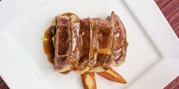 a plate of meat and sauce