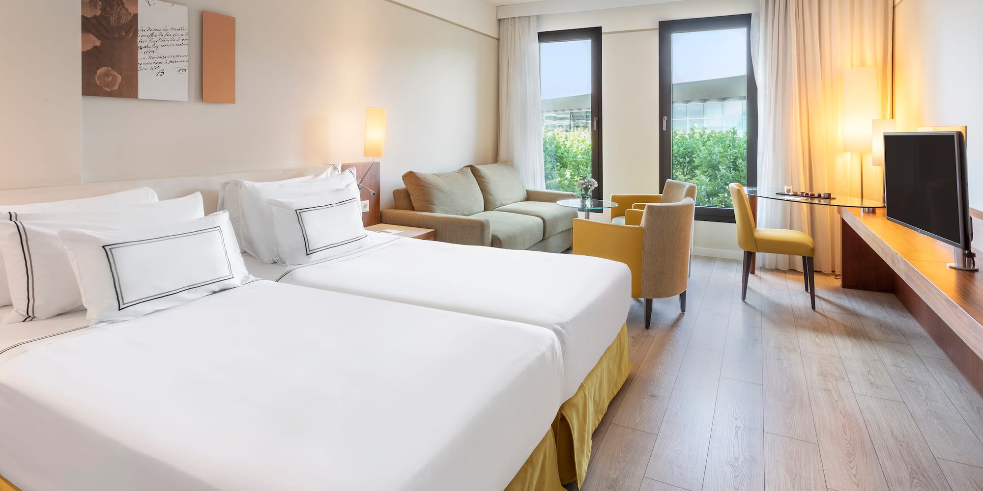 a room with two beds and a table