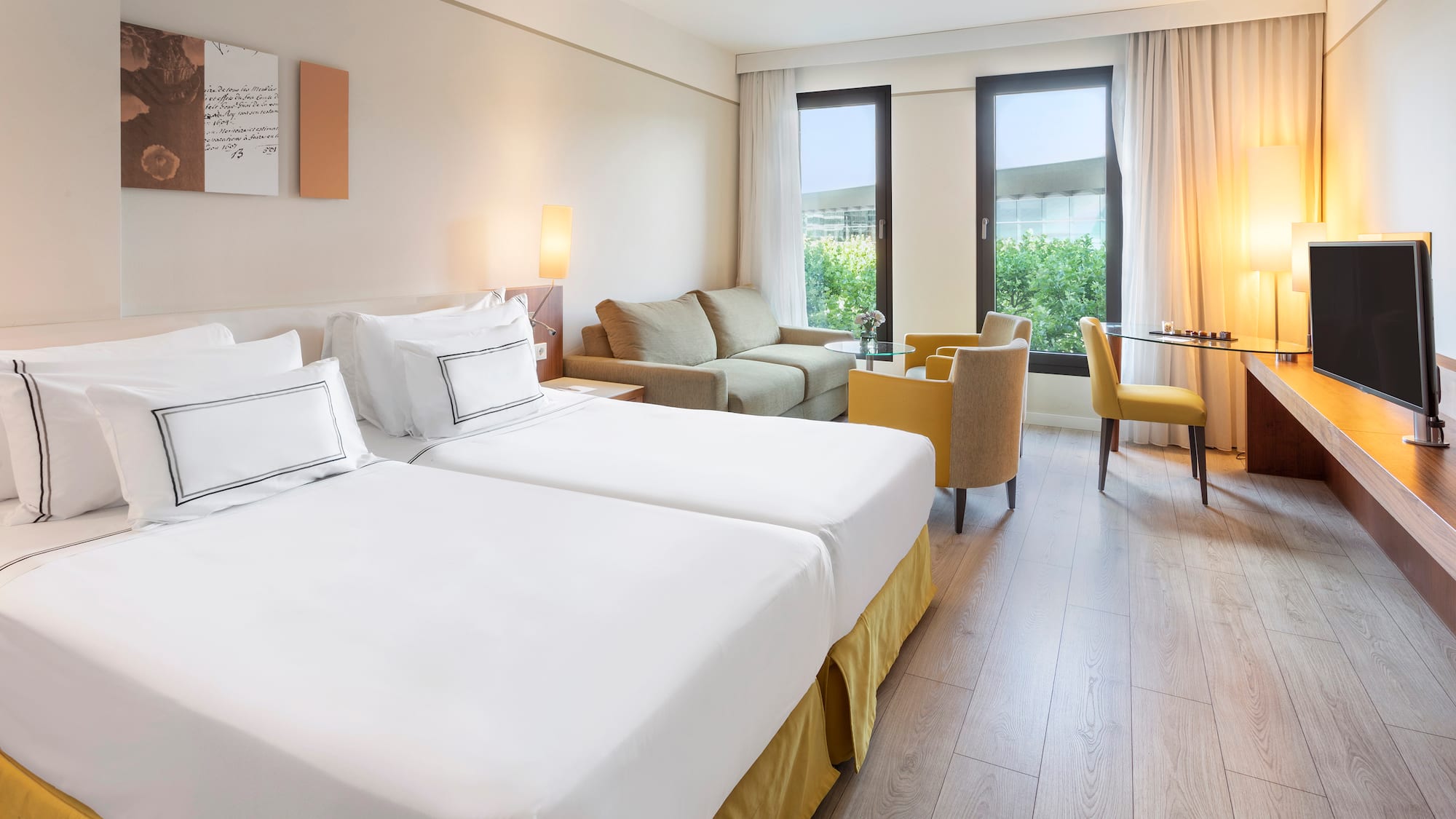 a room with two beds and a table