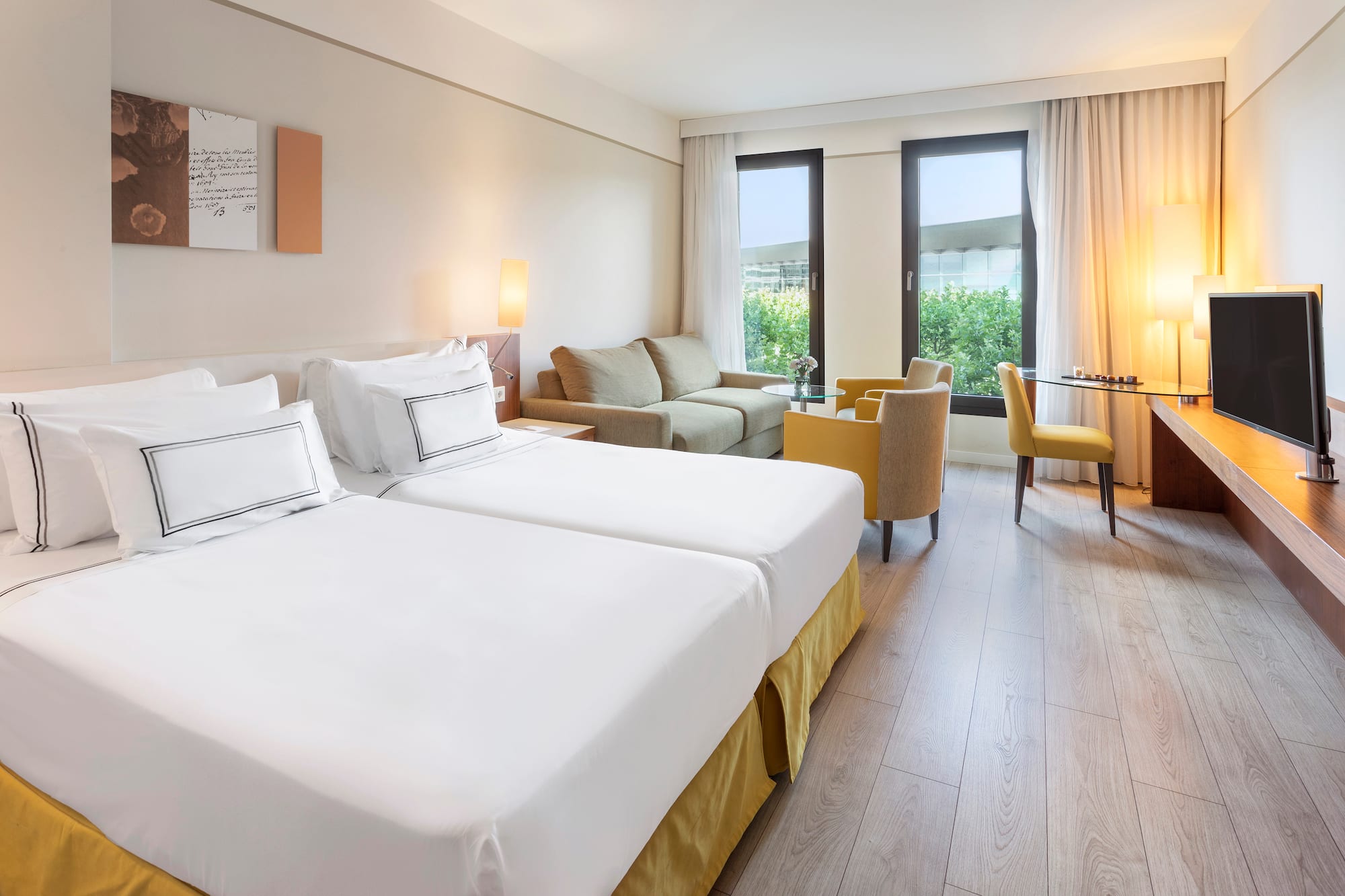 a room with two beds and a table