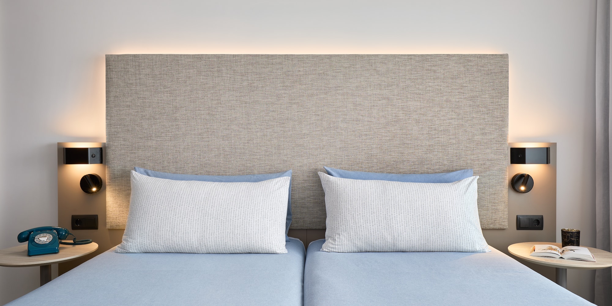 a bed with two pillows