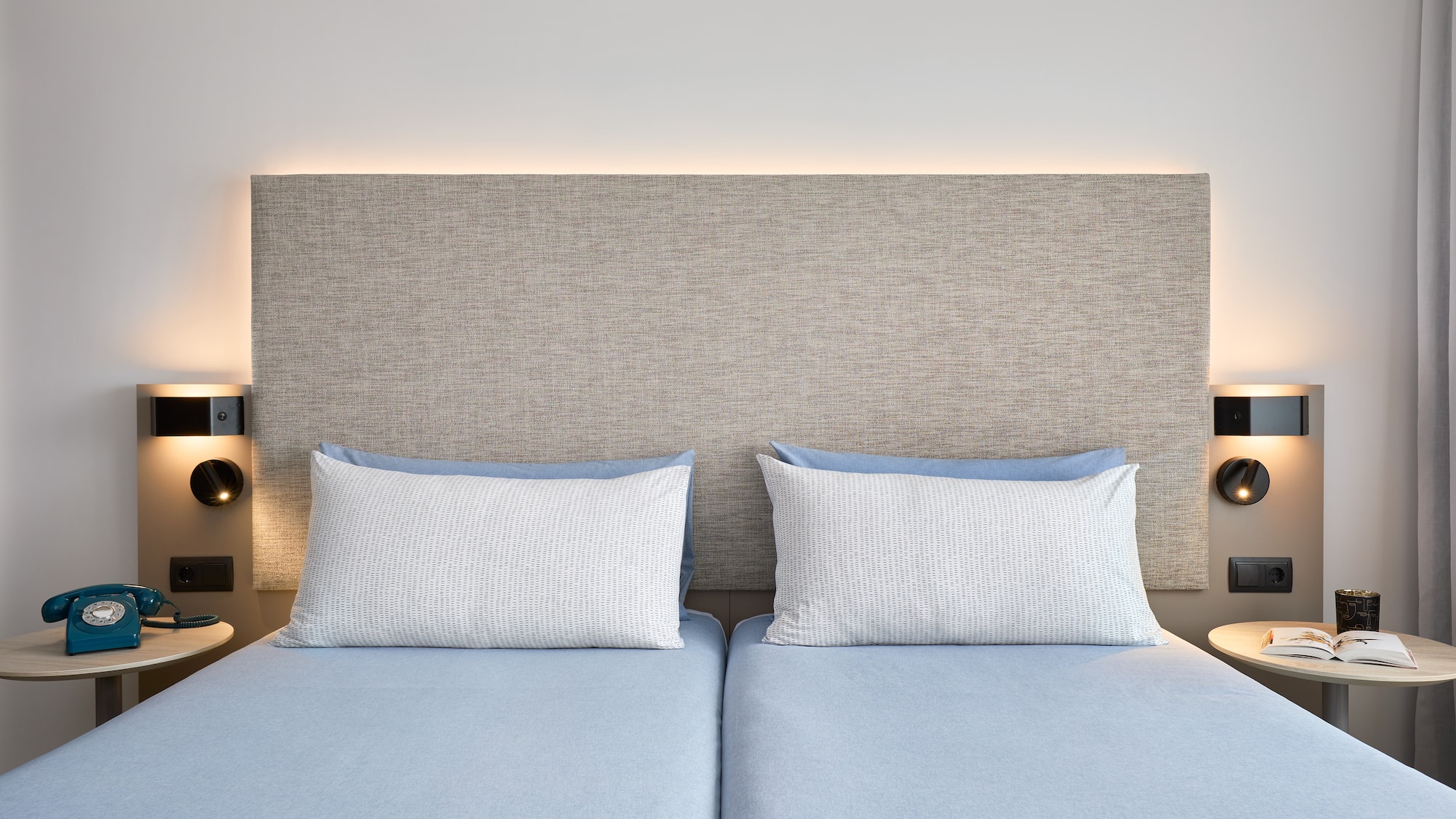 a bed with two pillows