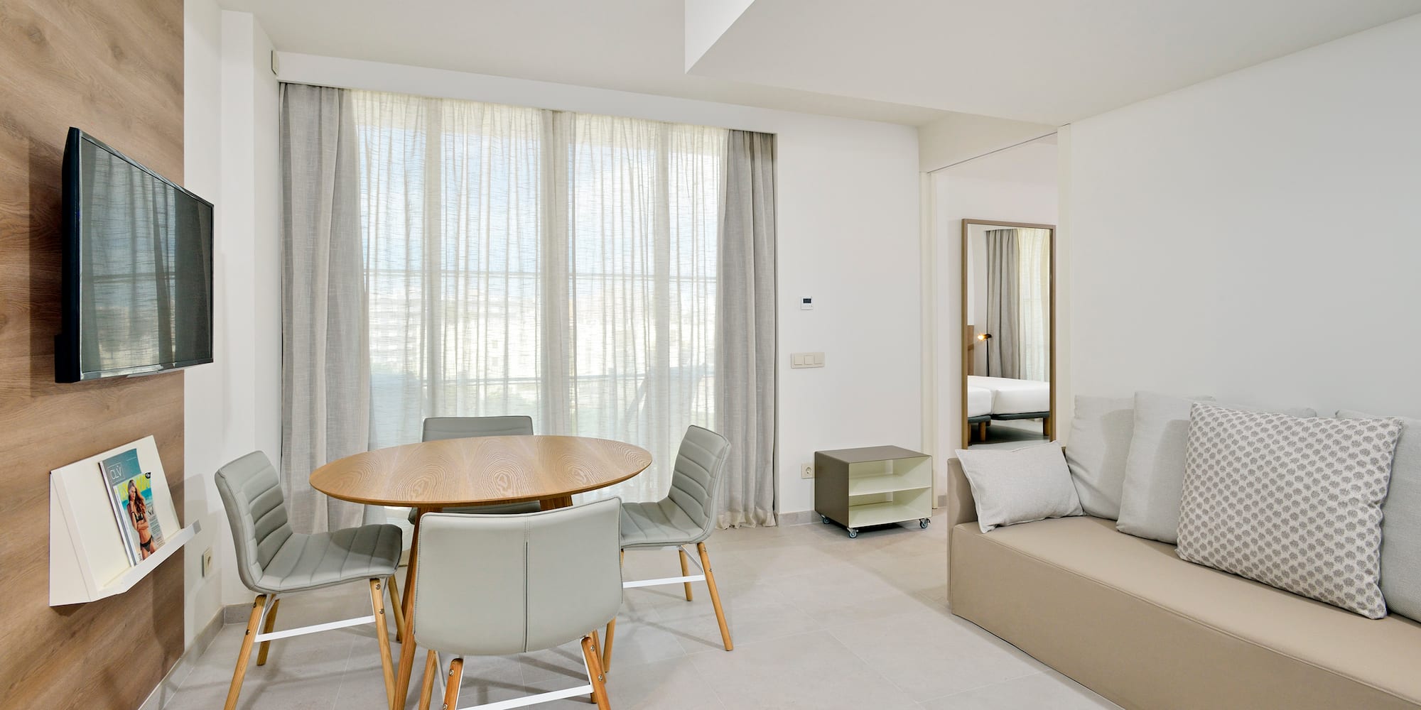 a room with a table and chairs