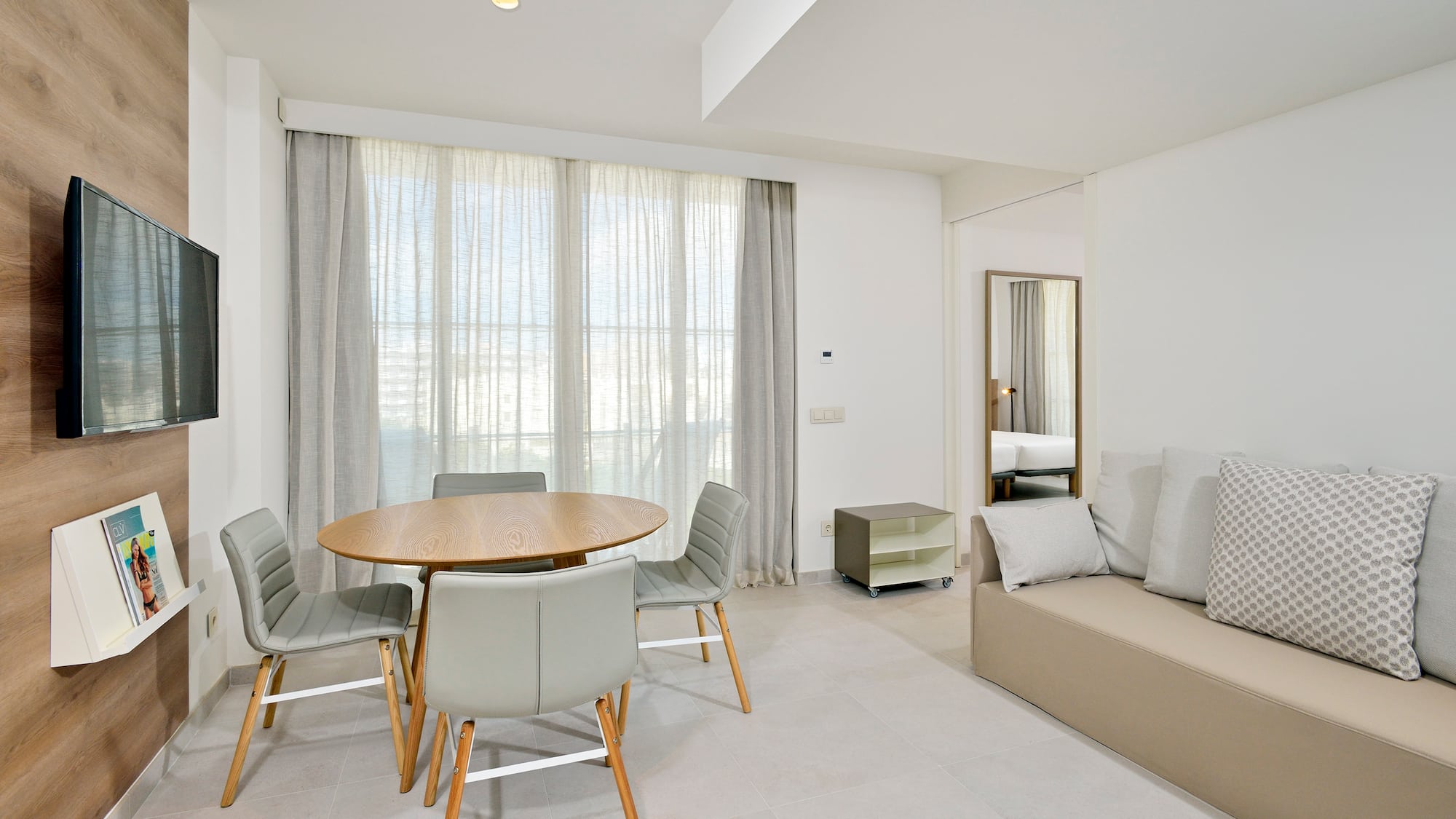 a room with a table and chairs