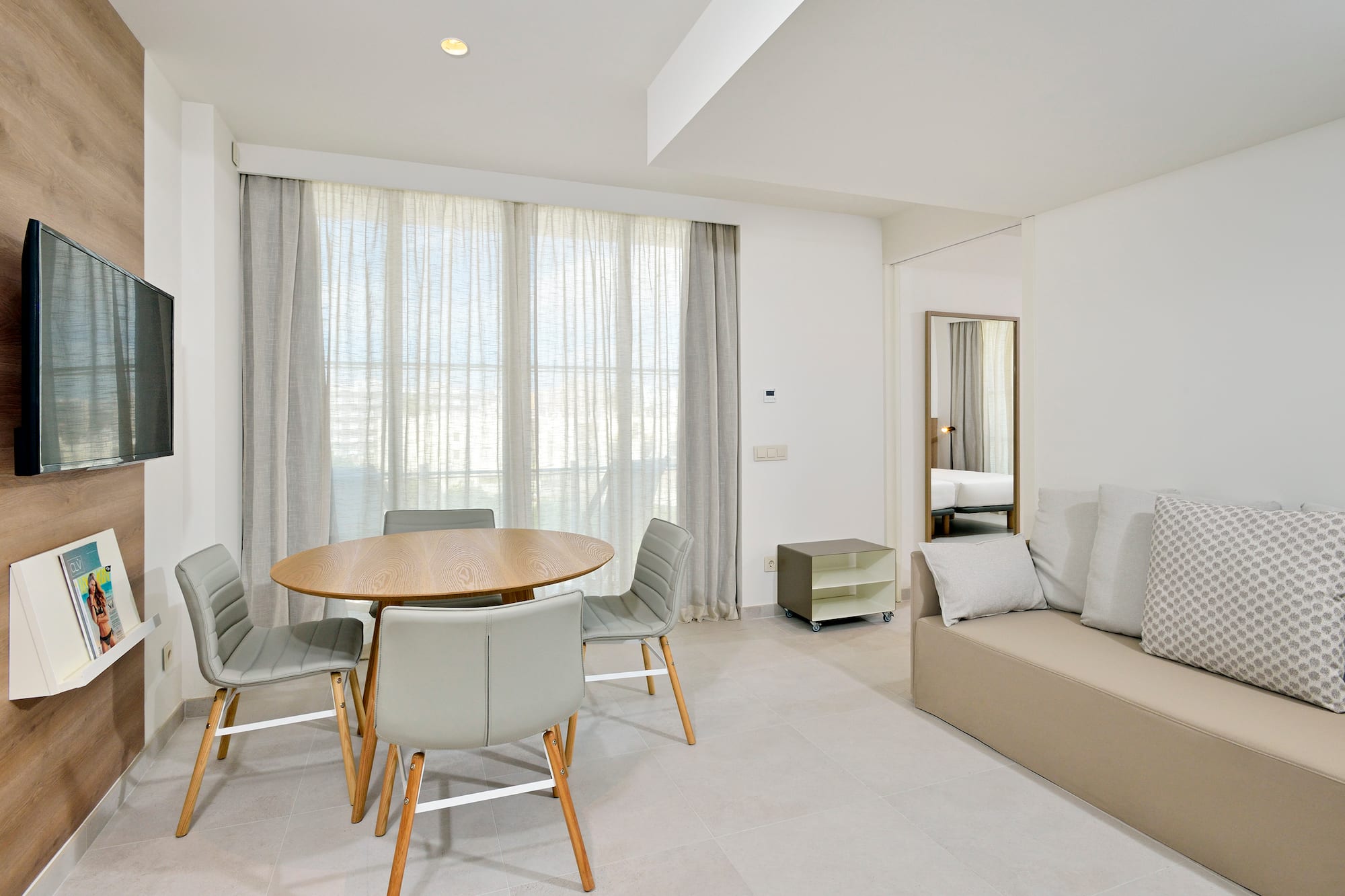 a room with a table and chairs