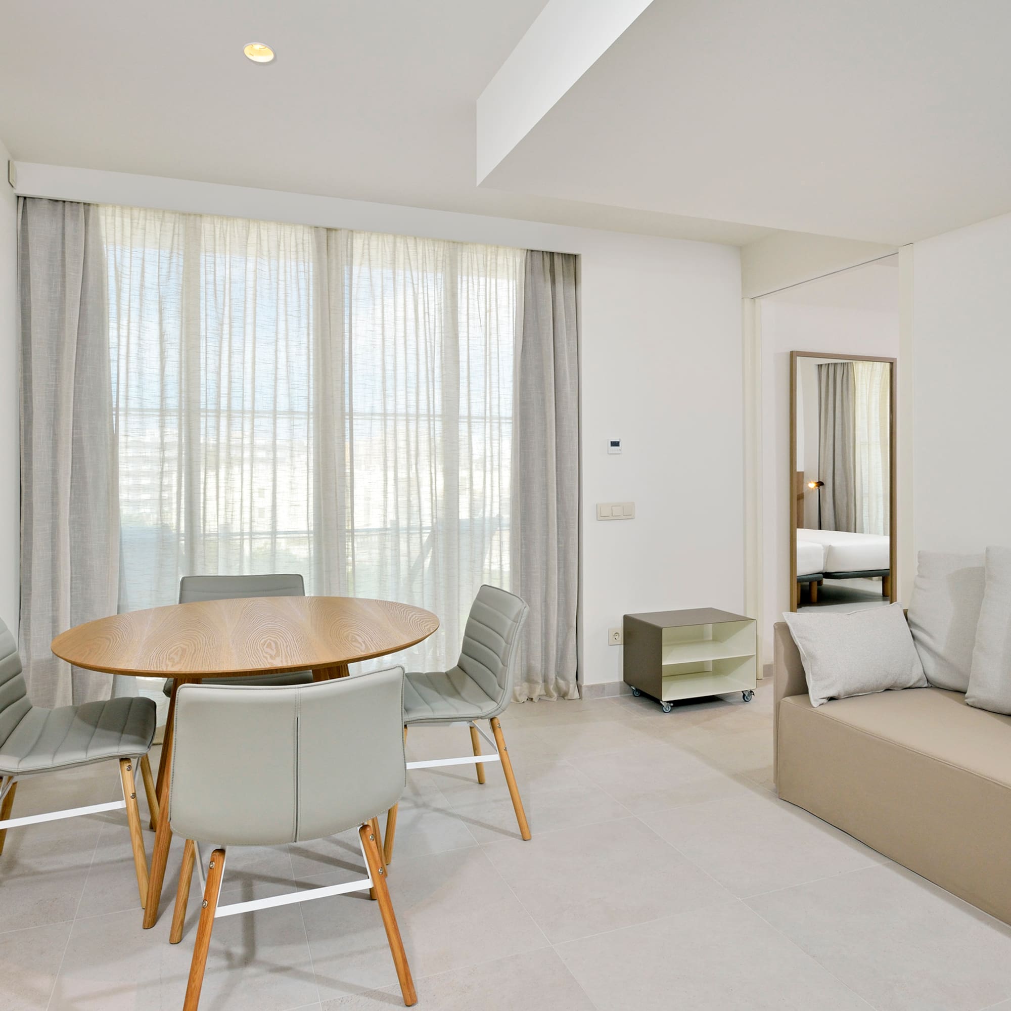 a room with a table and chairs