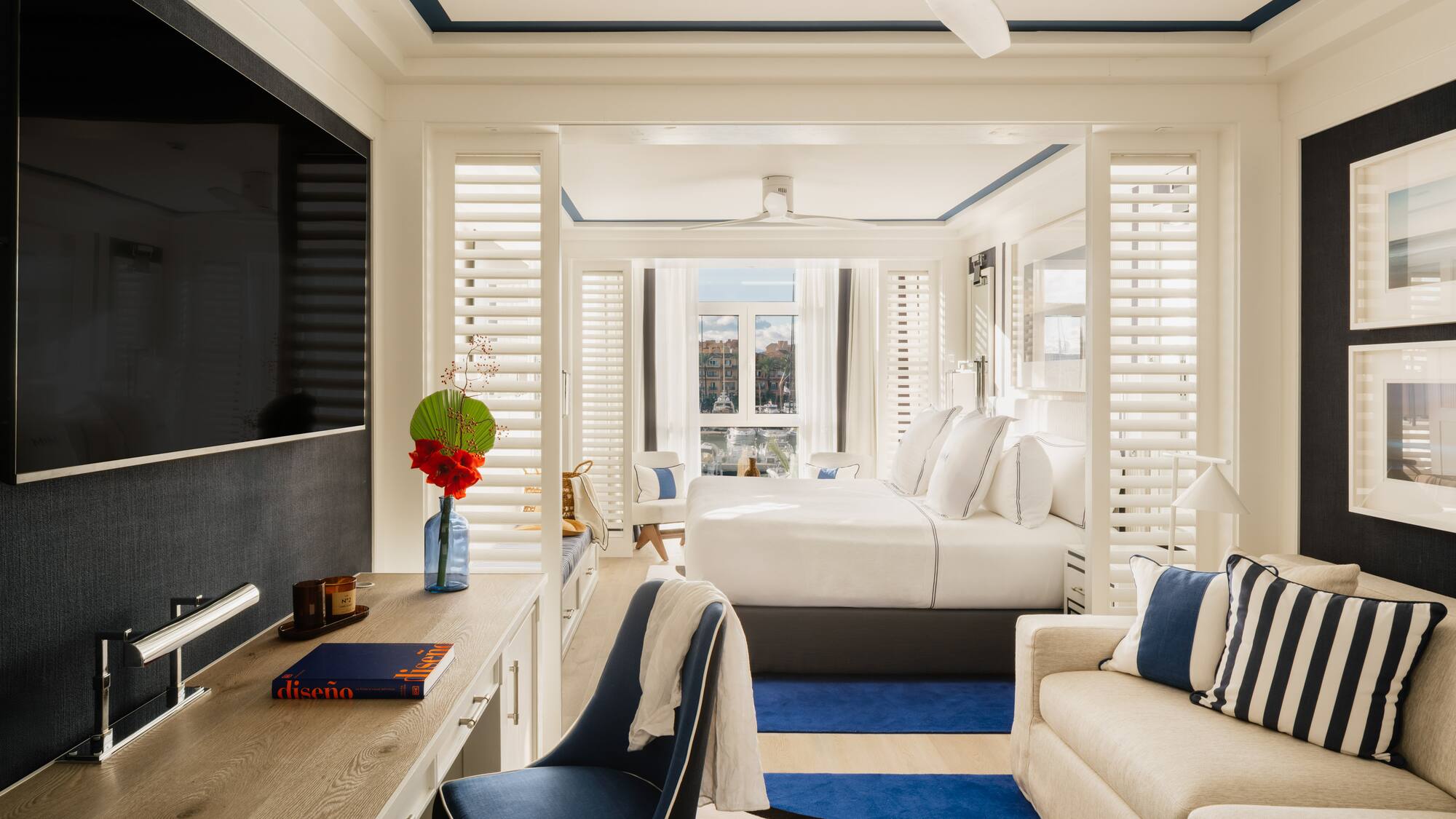 a room with a bed and a tv