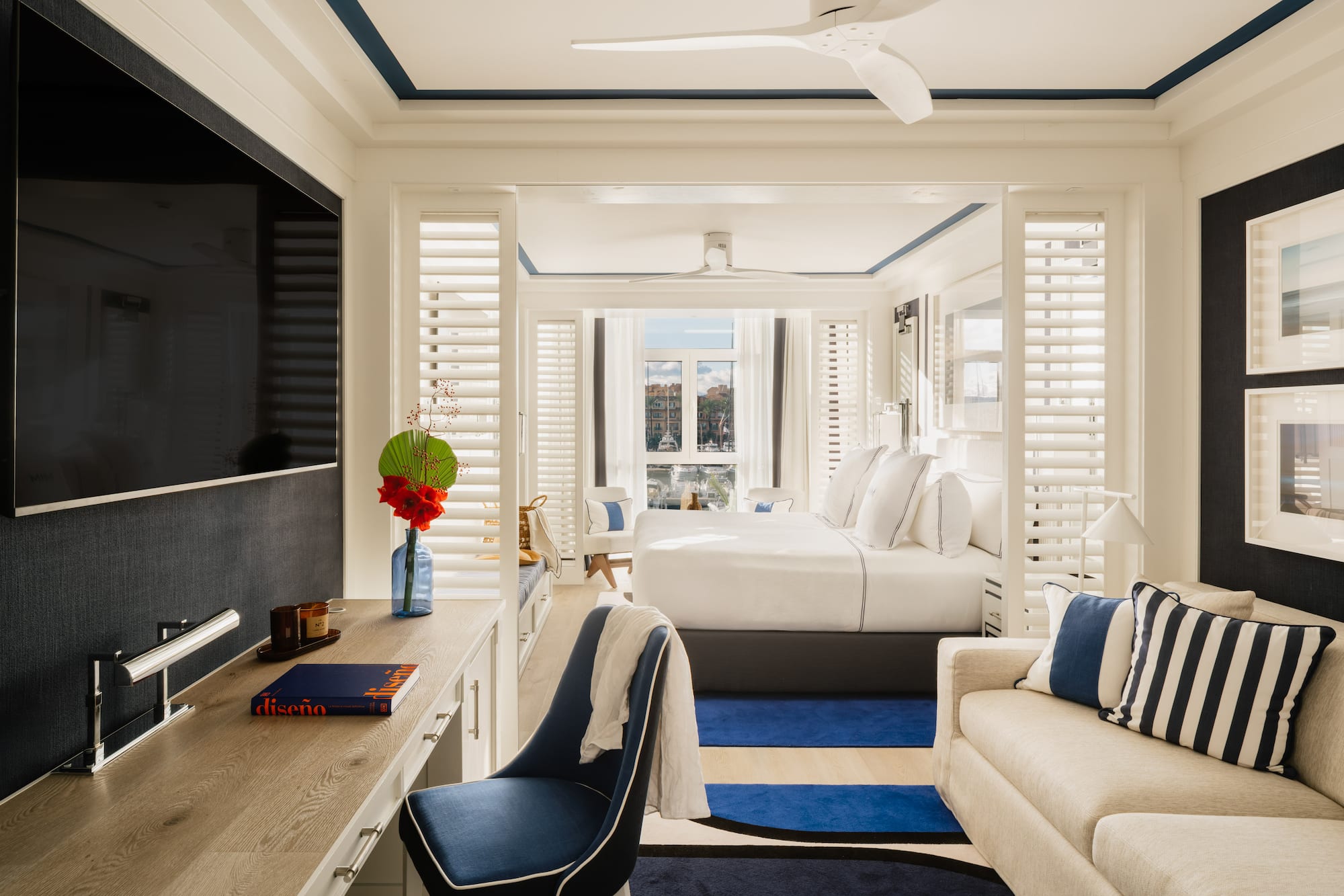 a room with a bed and a tv