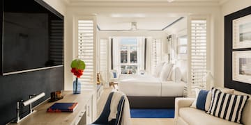 a room with a bed and a tv