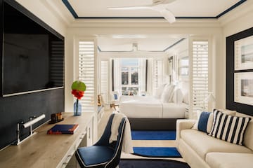 a room with a bed and a tv