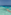 Maldives overwater bungalows over clear turquoise ocean reef.