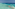 Maldives overwater bungalows over clear turquoise ocean reef.