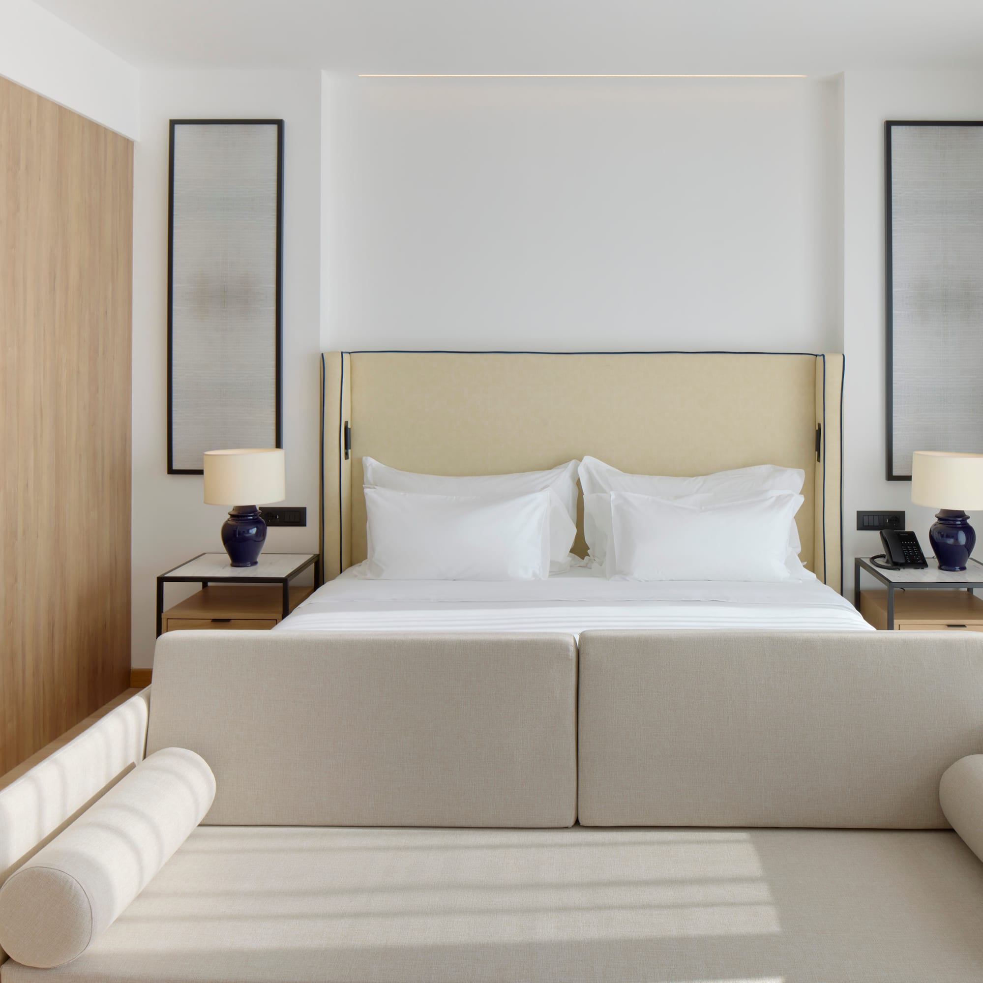 a bed with a couch and a lamp