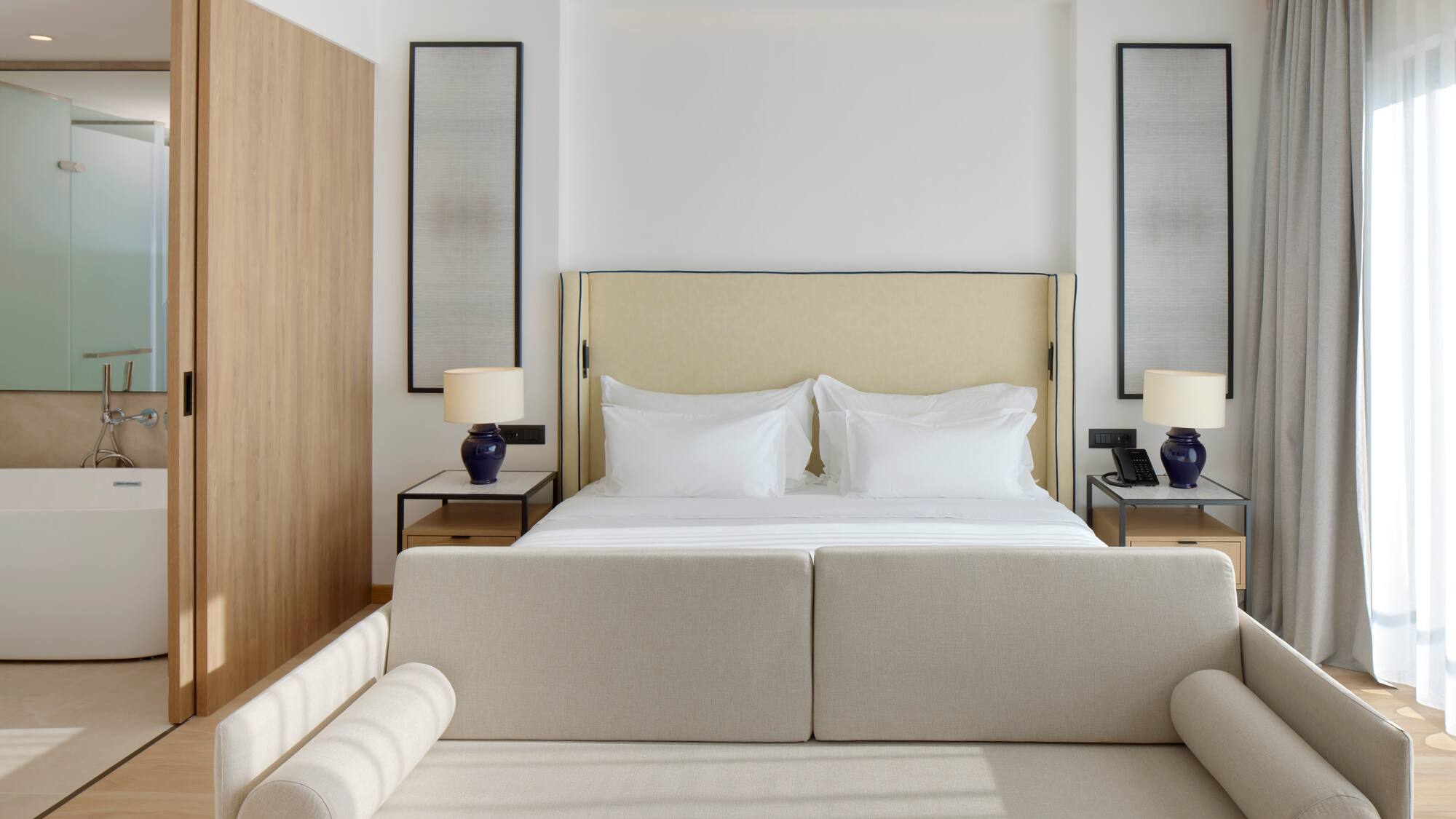 a bed with a couch and a lamp