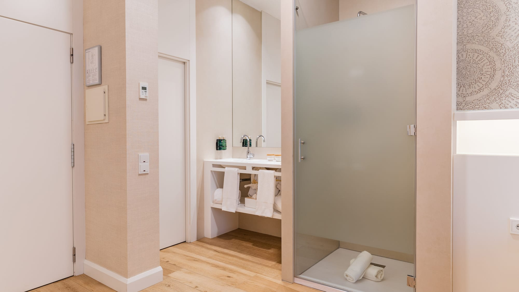 a bathroom with a glass shower door