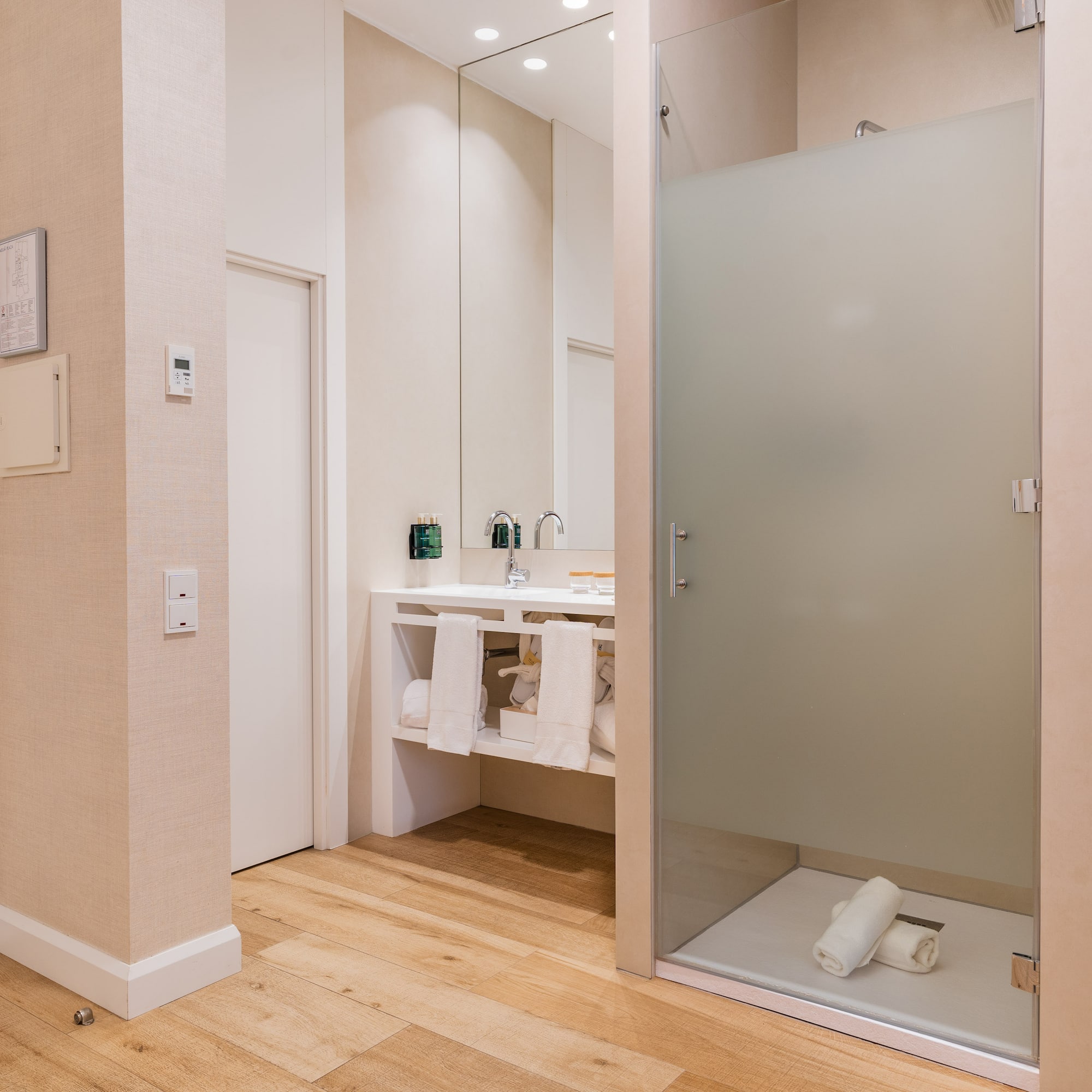a bathroom with a glass shower door