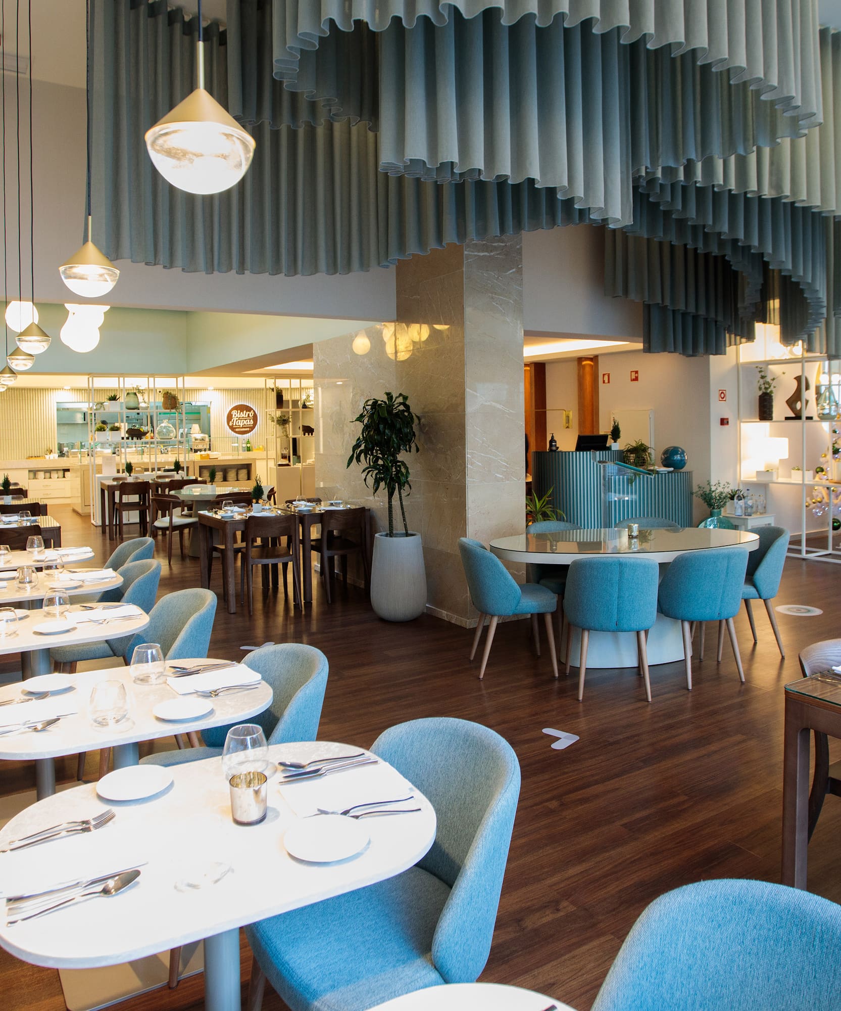 a restaurant with tables and chairs