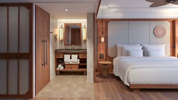 a room with a bed and a sink