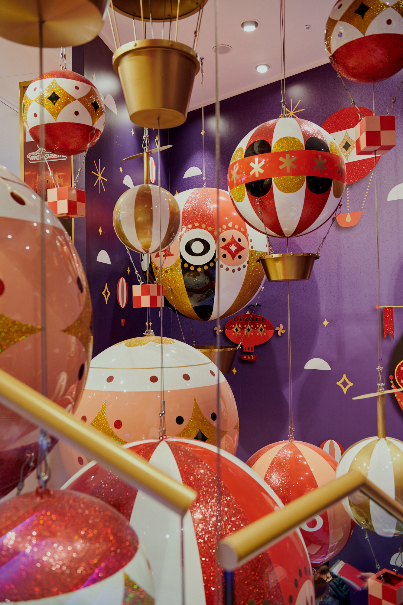 a group of colorful balloons from a ceiling