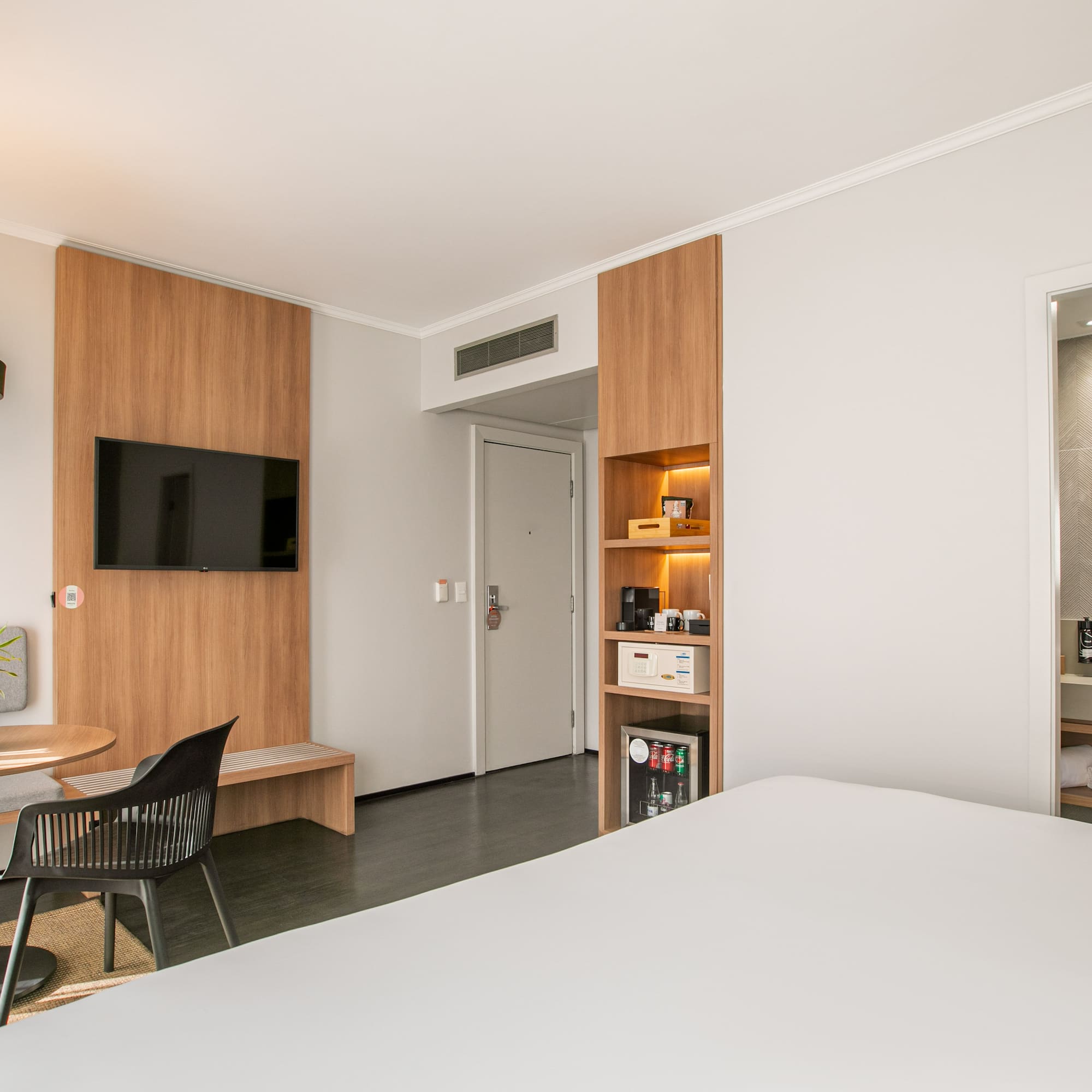 a room with a tv and a door