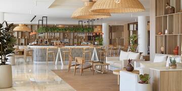 a room with a bar and chairs