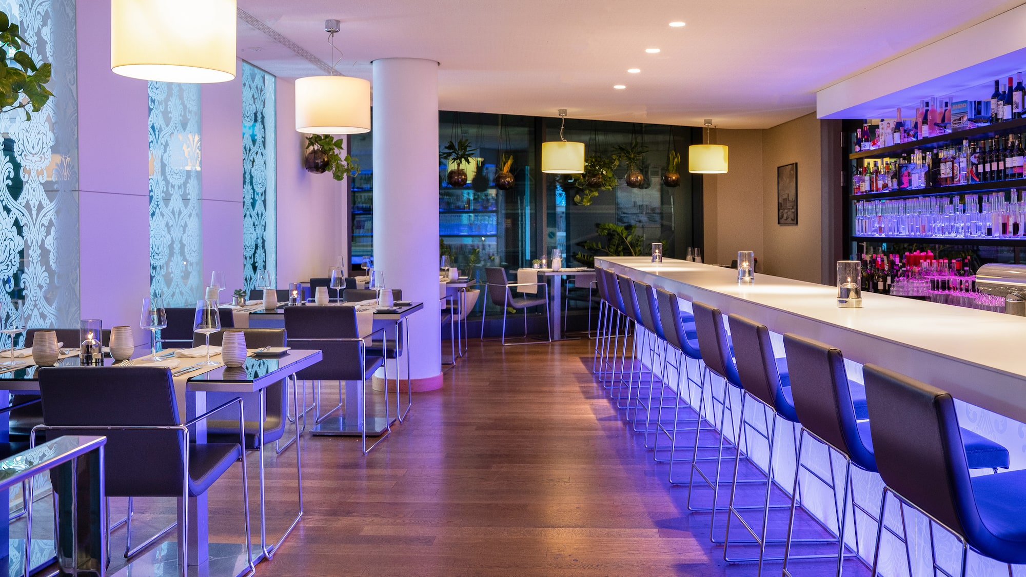a long table with chairs and lights