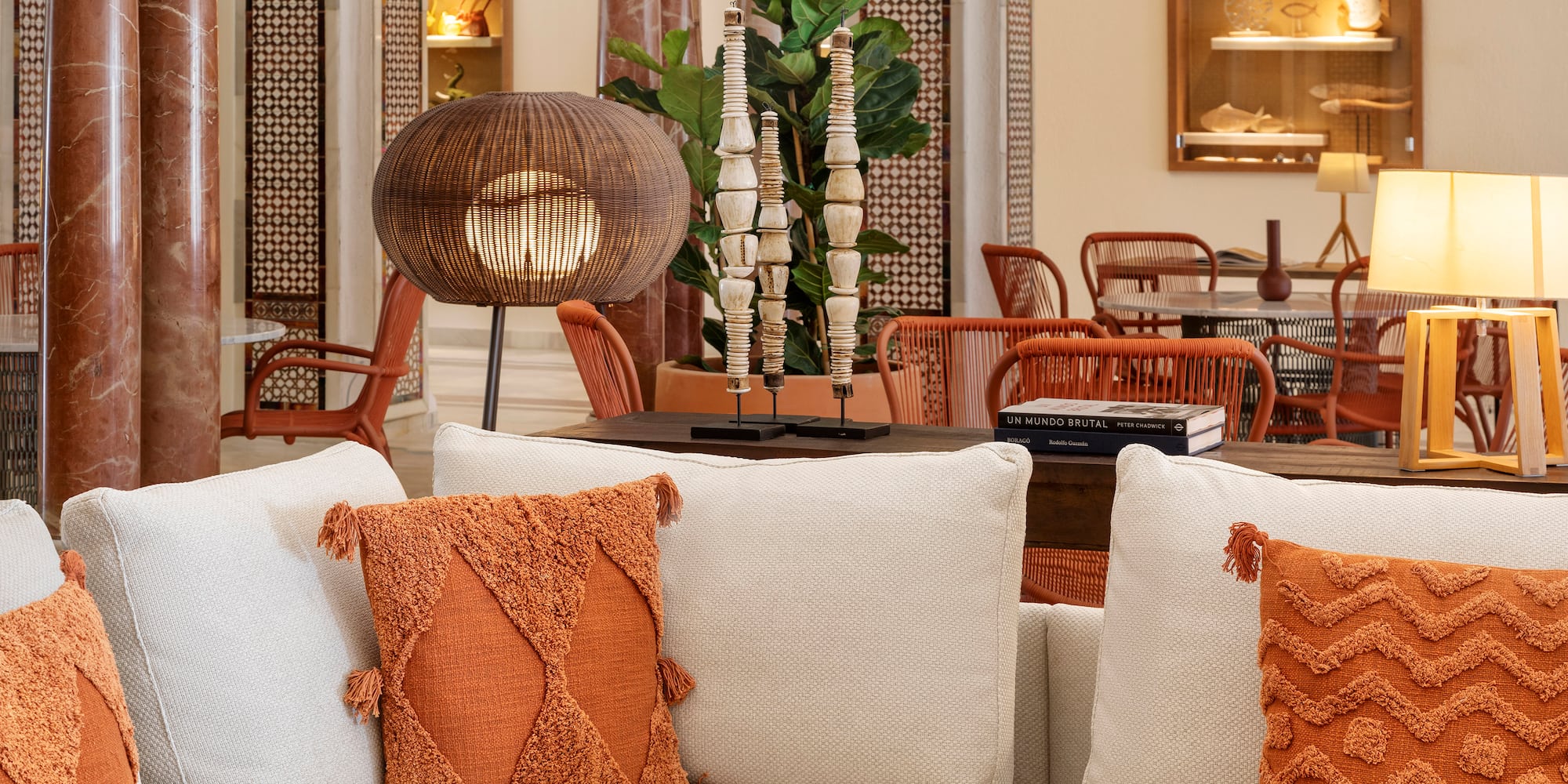 a room with a couch and chairs