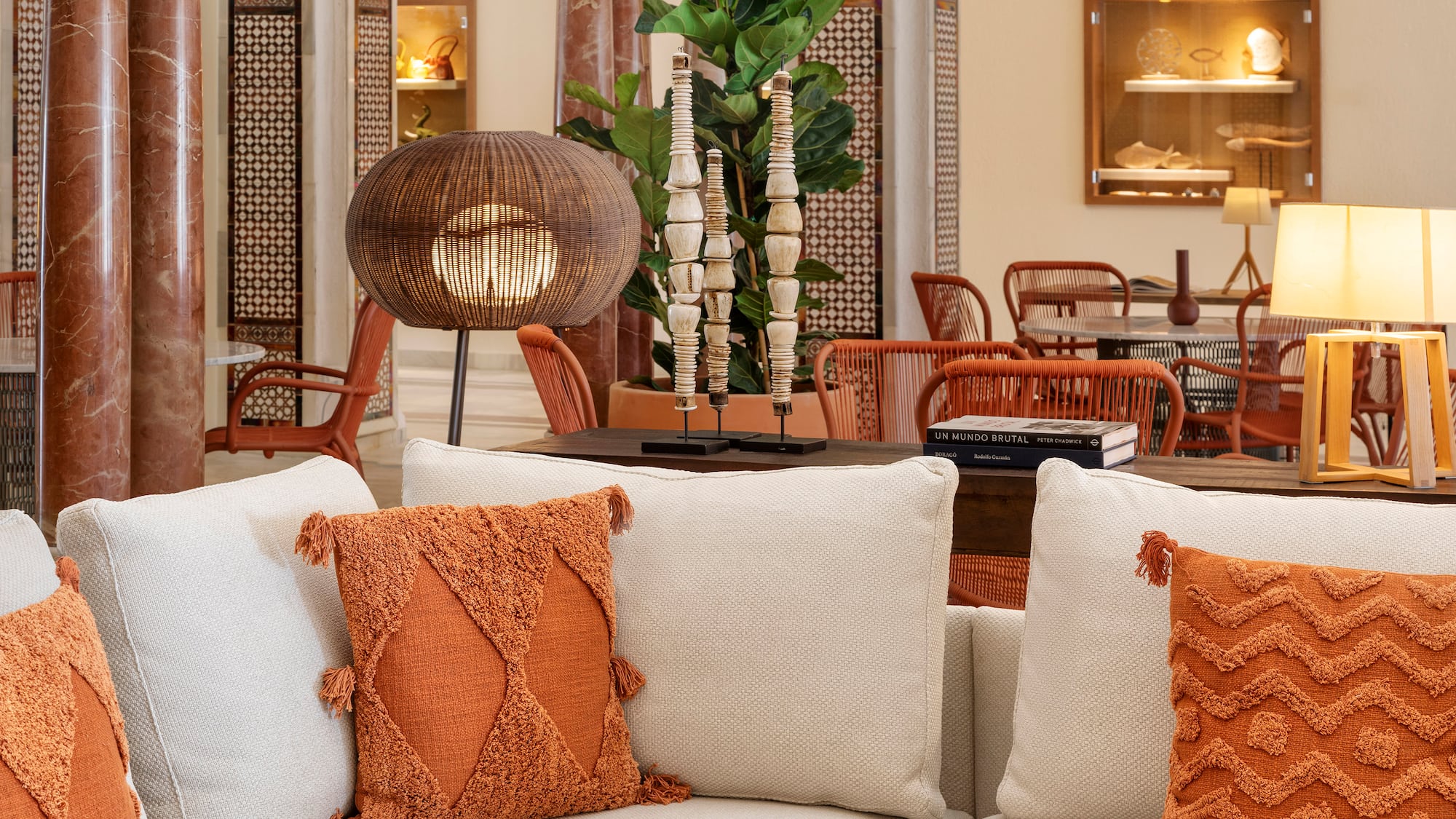 a room with a couch and chairs