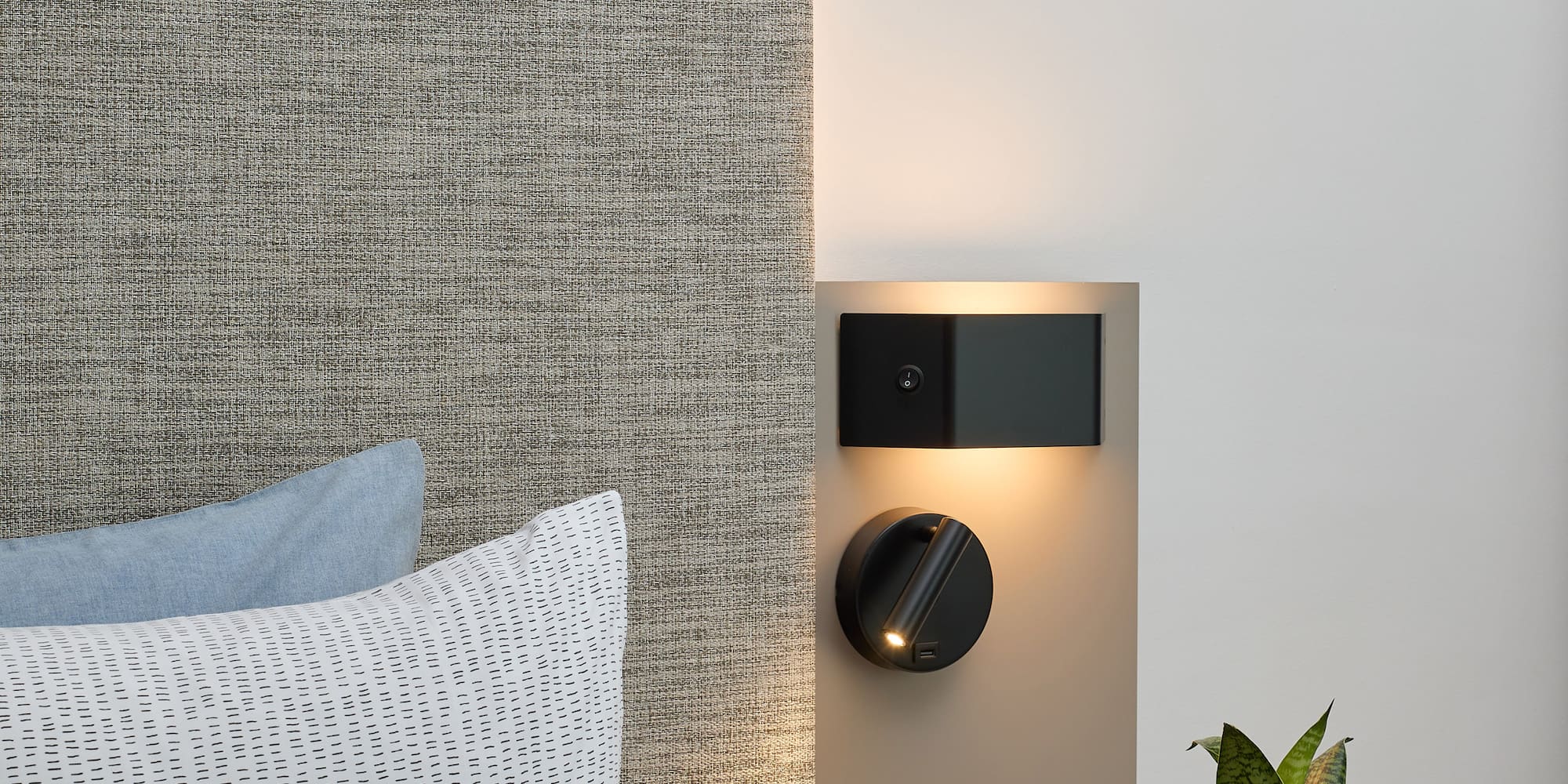 a small table with a plant on it next to a wall