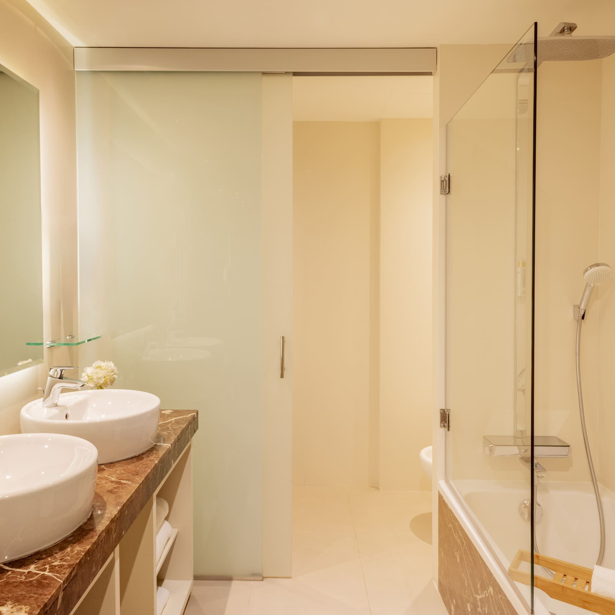 a bathroom with a shower and sink