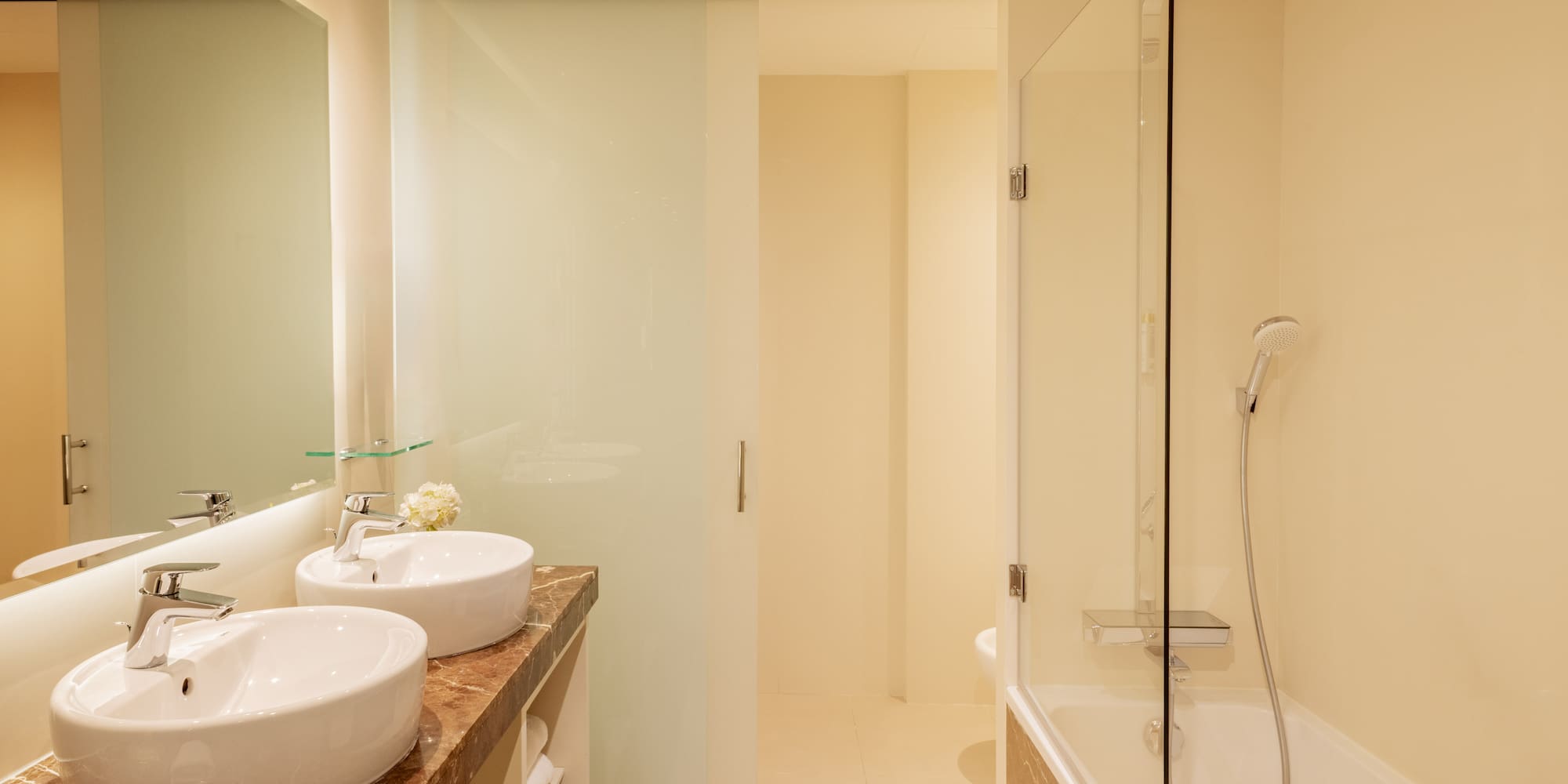 a bathroom with a shower and sink