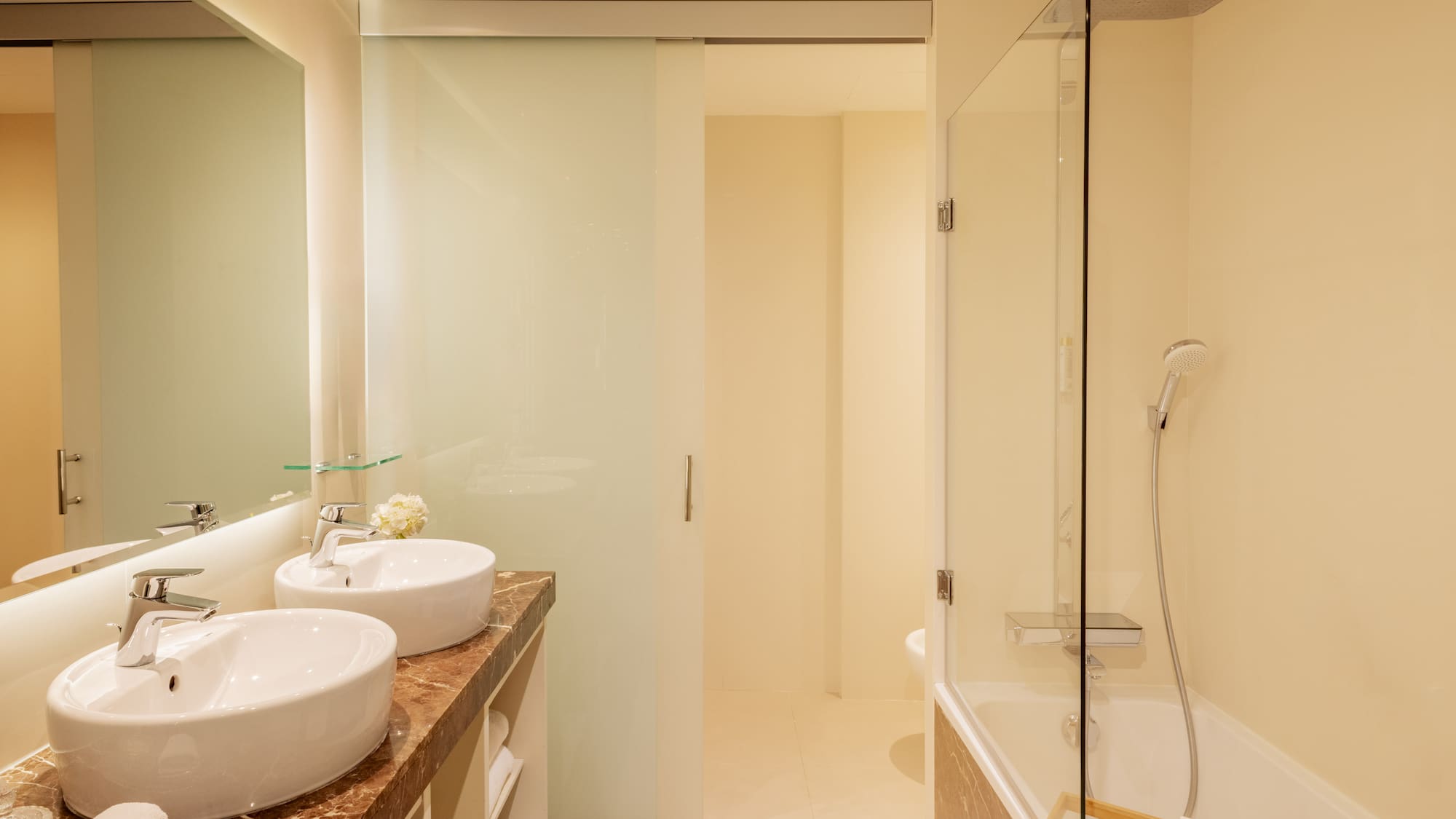 a bathroom with a shower and sink