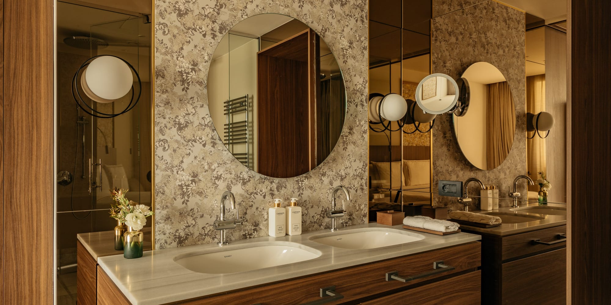 Classic bathroom with a mirror and sink at a Premier Room from the Palazzo Cordusio Gran Melia Hotel