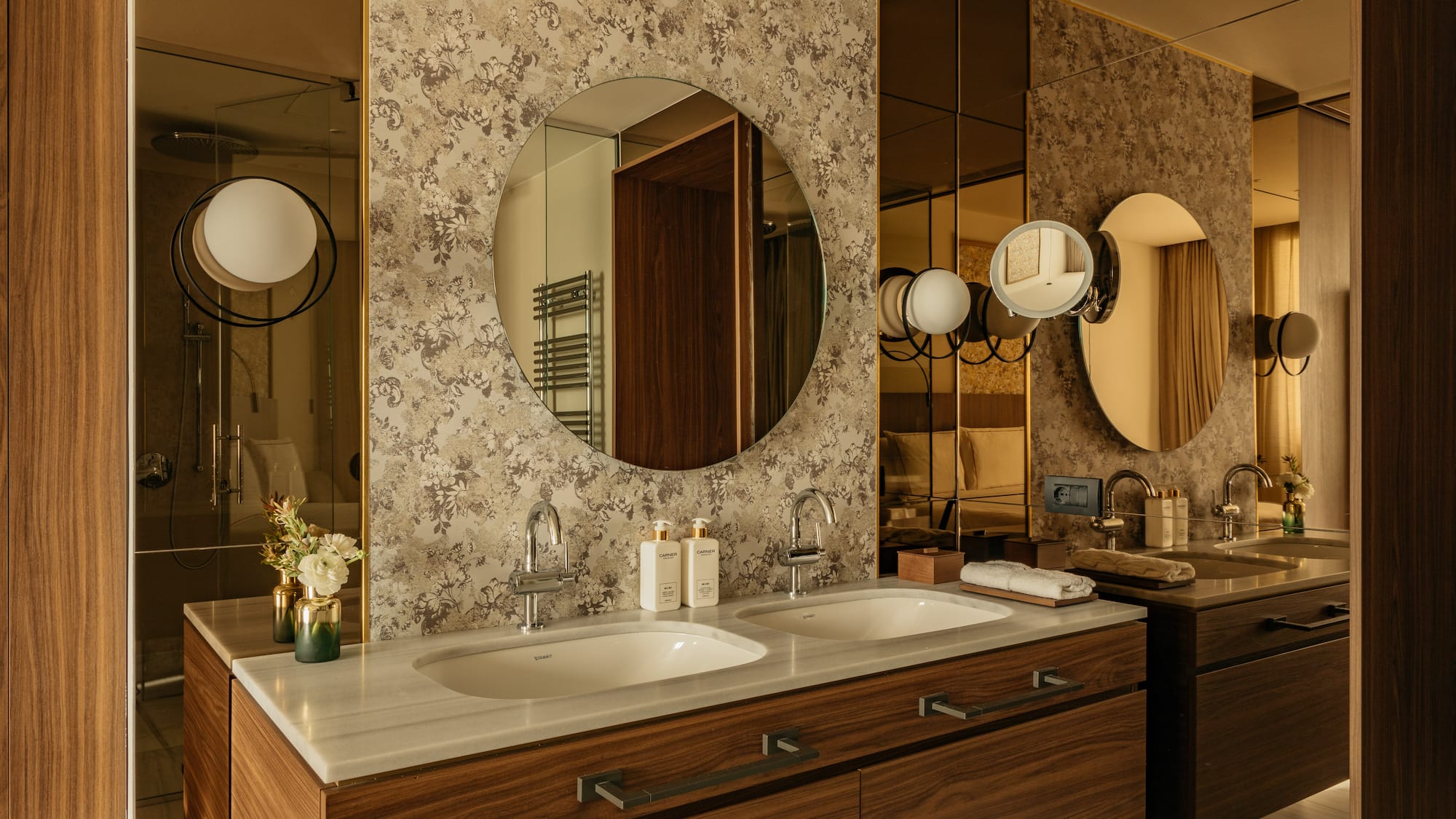 Classic bathroom with a mirror and sink at a Premier Room from the Palazzo Cordusio Gran Melia Hotel