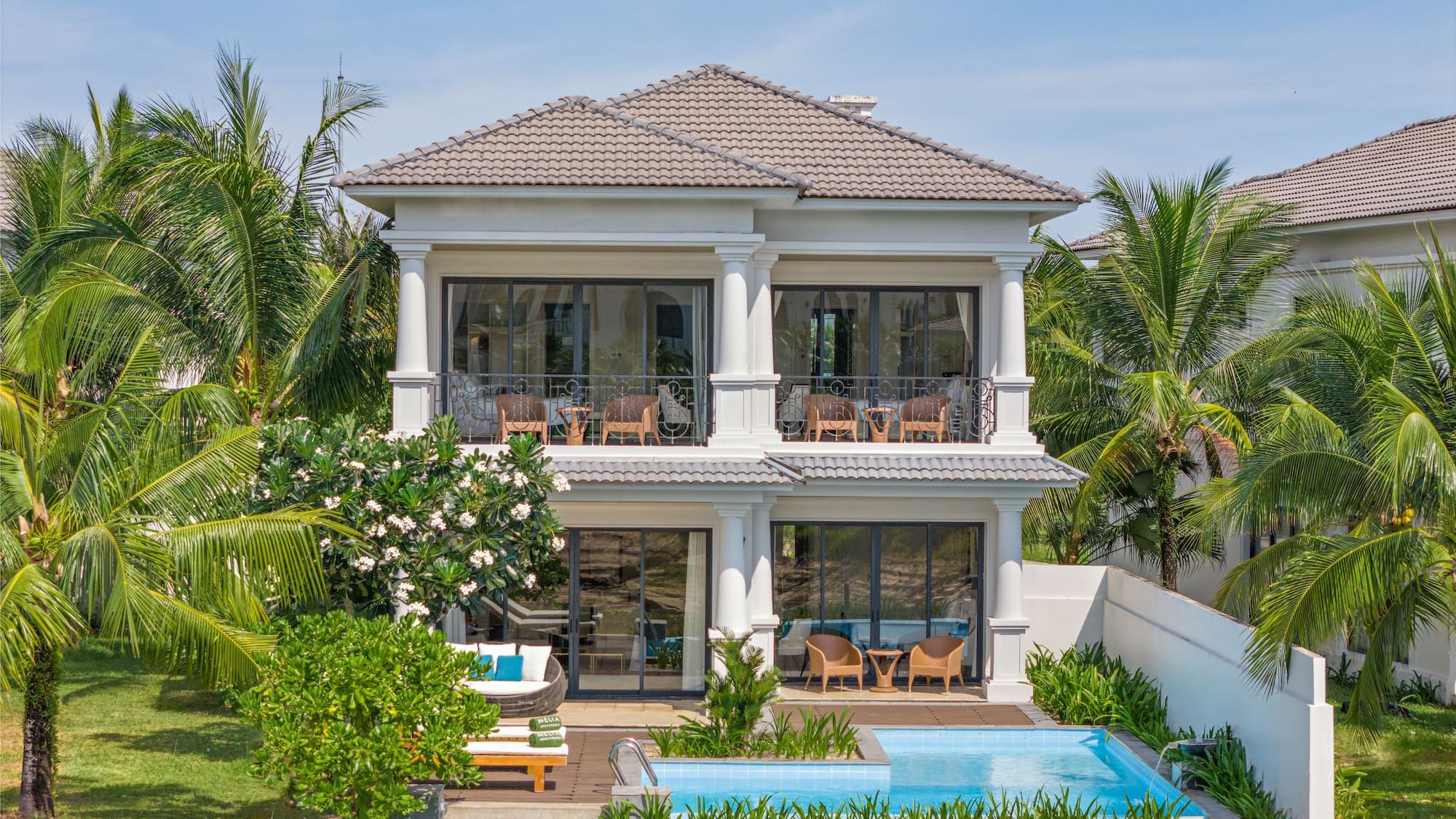 a house with a pool in the back
