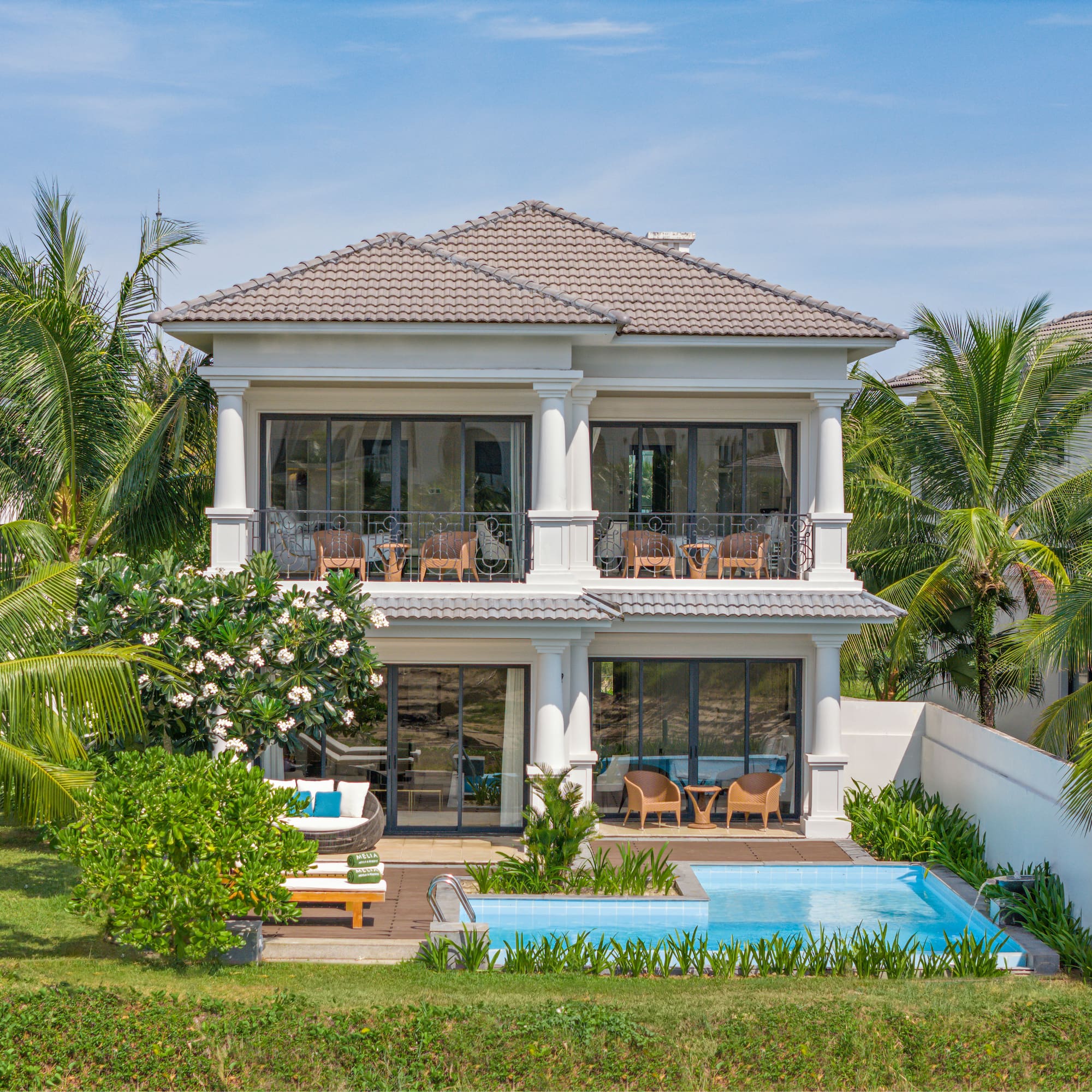 a house with a pool in the back
