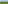 Tropical banana field next to the blue ocean under a bright sky.